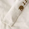 Camiseta de manguitos largos con logo «Dearborn» de corte holgado y tejido grueso para mujer